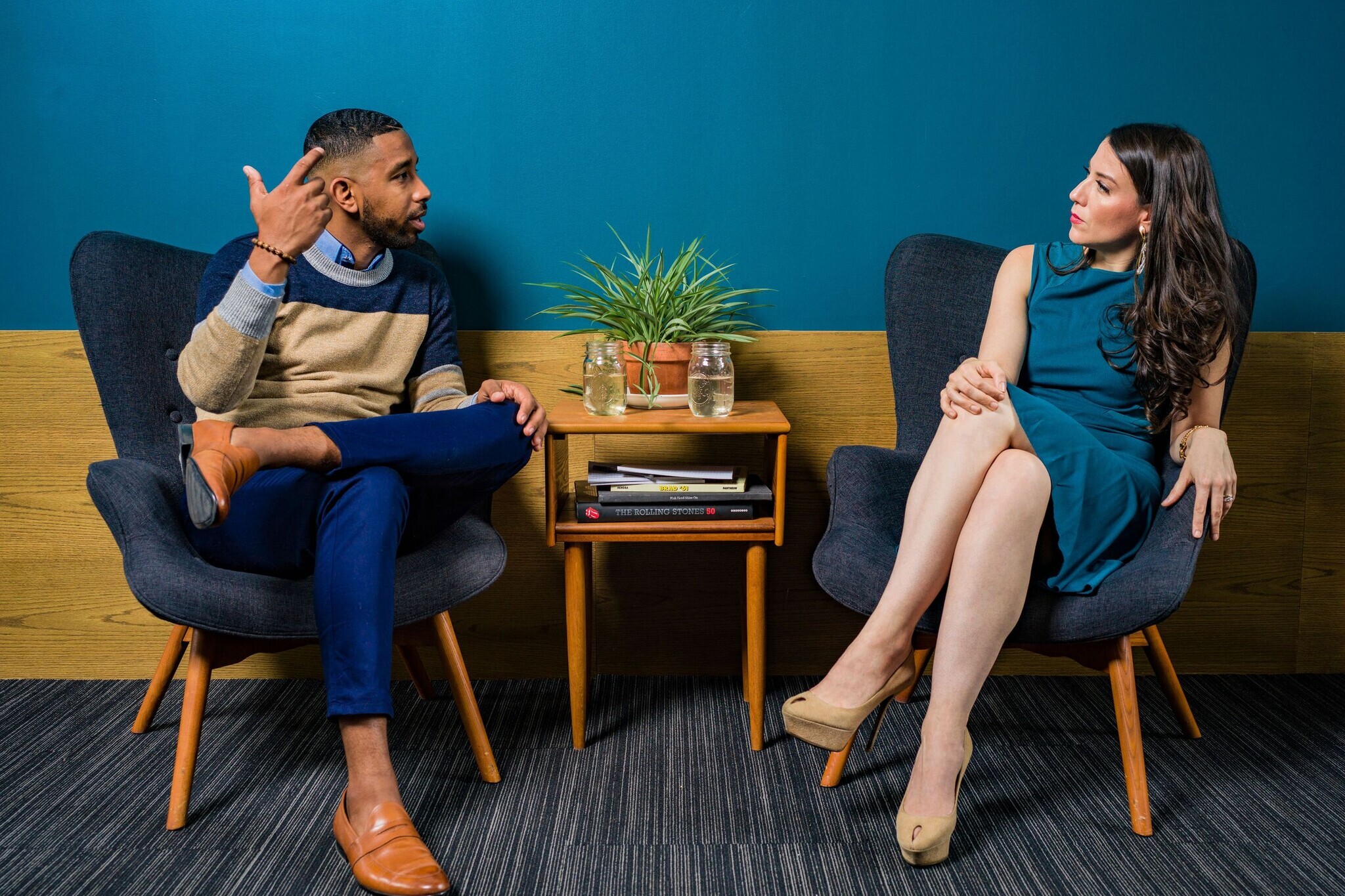 Two professionals in conversation in an elegant contemporary setting