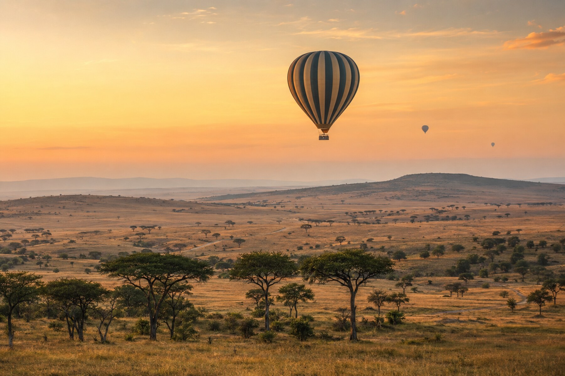 Hot-air balloon above the Maasai Mara at sunrise