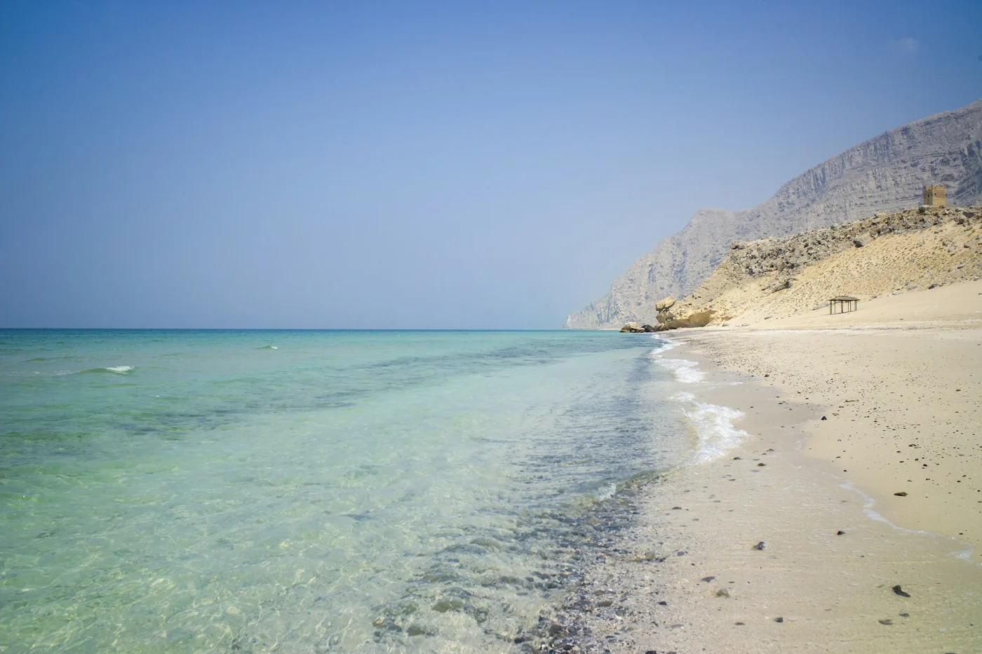 Clear coastal water and rugged mountains in Musandam