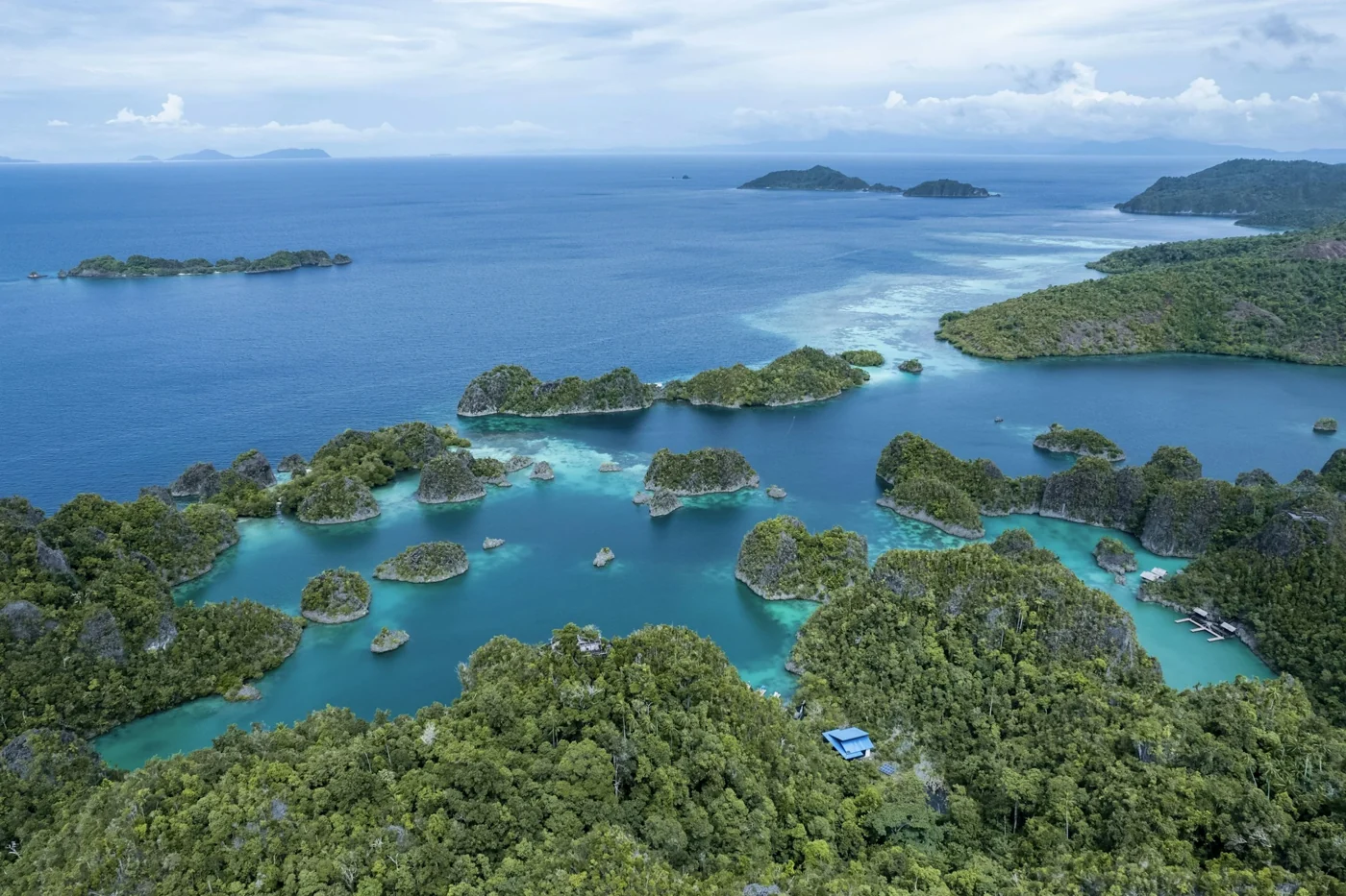 Green islands and turquoise lagoons around Piaynemo, Raja Ampat