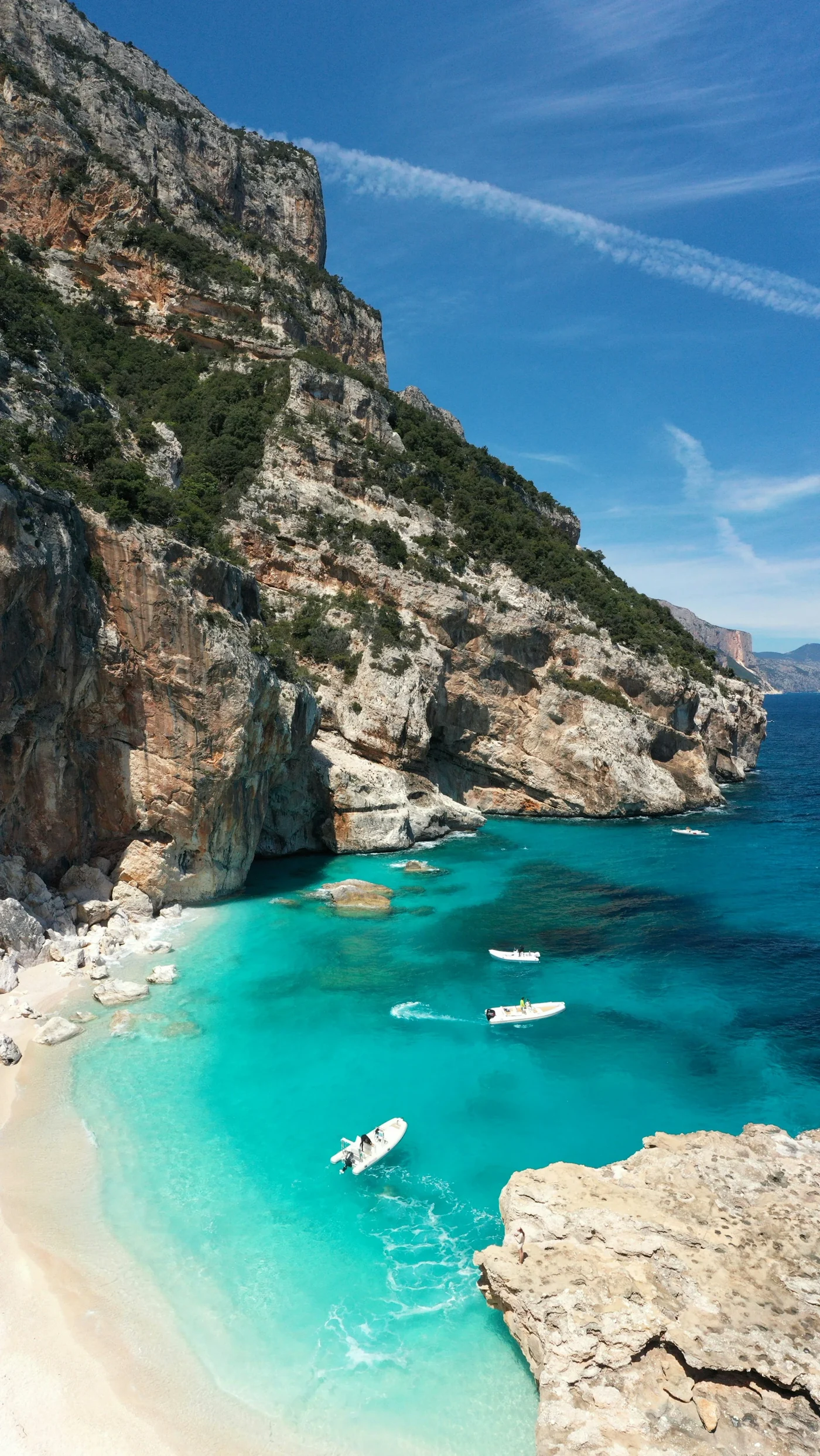 Turquoise water beneath cliffs at Cala dei Gabbiani, Sardinia